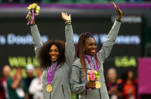 Gold medalists Serena Williams of the United States and Venus Williams of the United States celebrate on the popdium during the medal ceremony for the Women’s Doubles Tennis on Day 9 of the London 2012 Olympic Game